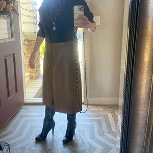 Boot. High leather boots with gold buckle